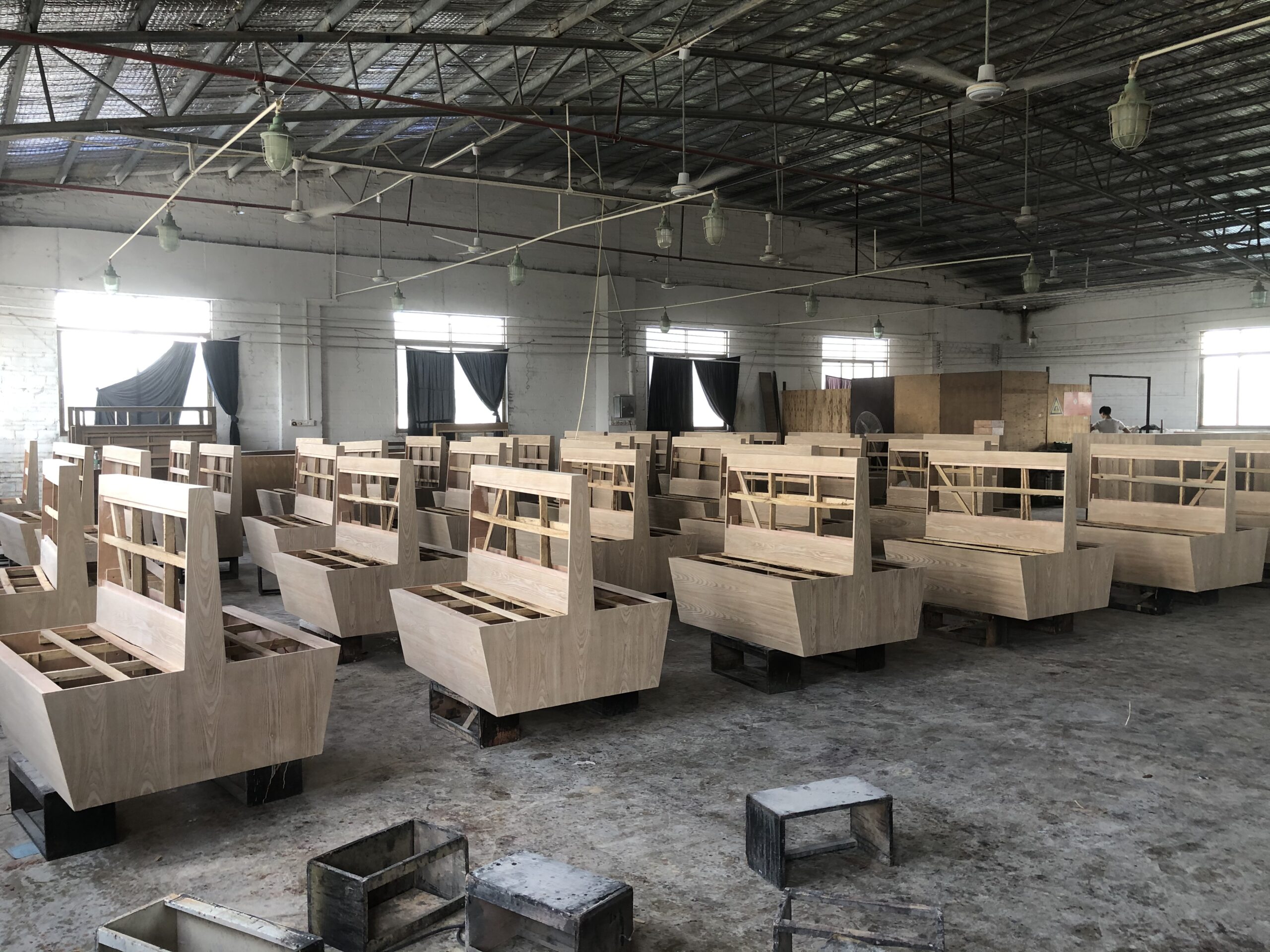 carpenter assembling plywood booth frame