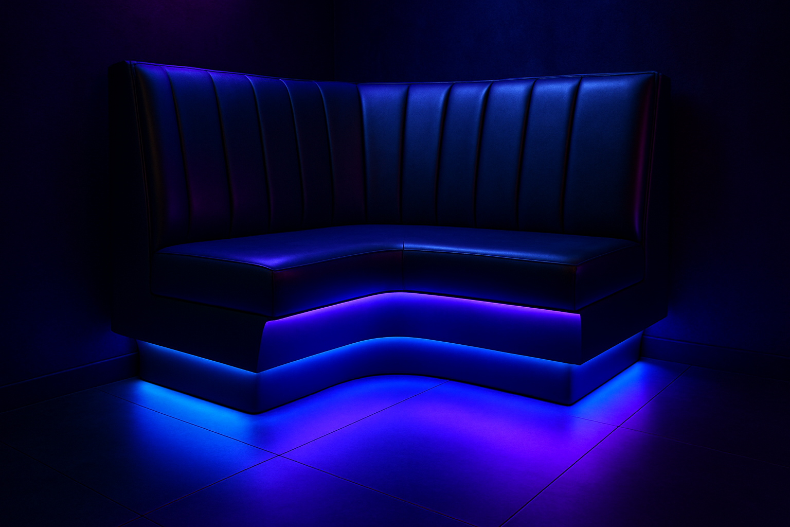 a custom nightclub booth with integrated LED lighting under the seat, creating a floating effect
