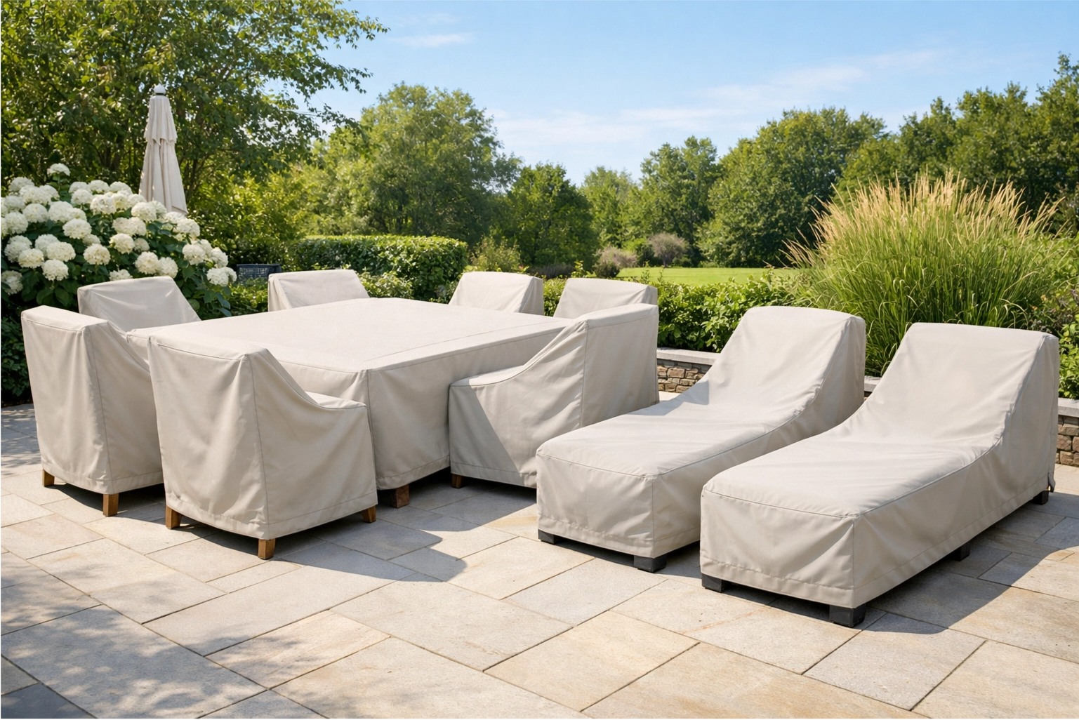 A pristine set of outdoor wood furniture neatly protected under high-quality, breathable covers
