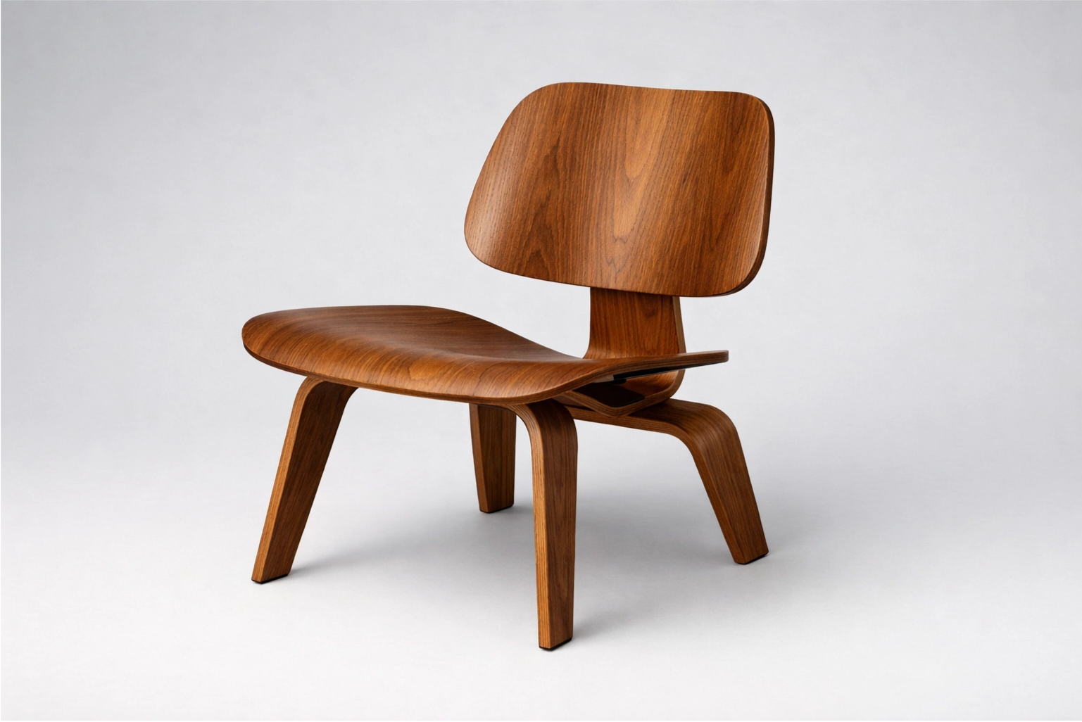 A classic Eames molded plywood chair, a perfect example of Mid-Century Modern style